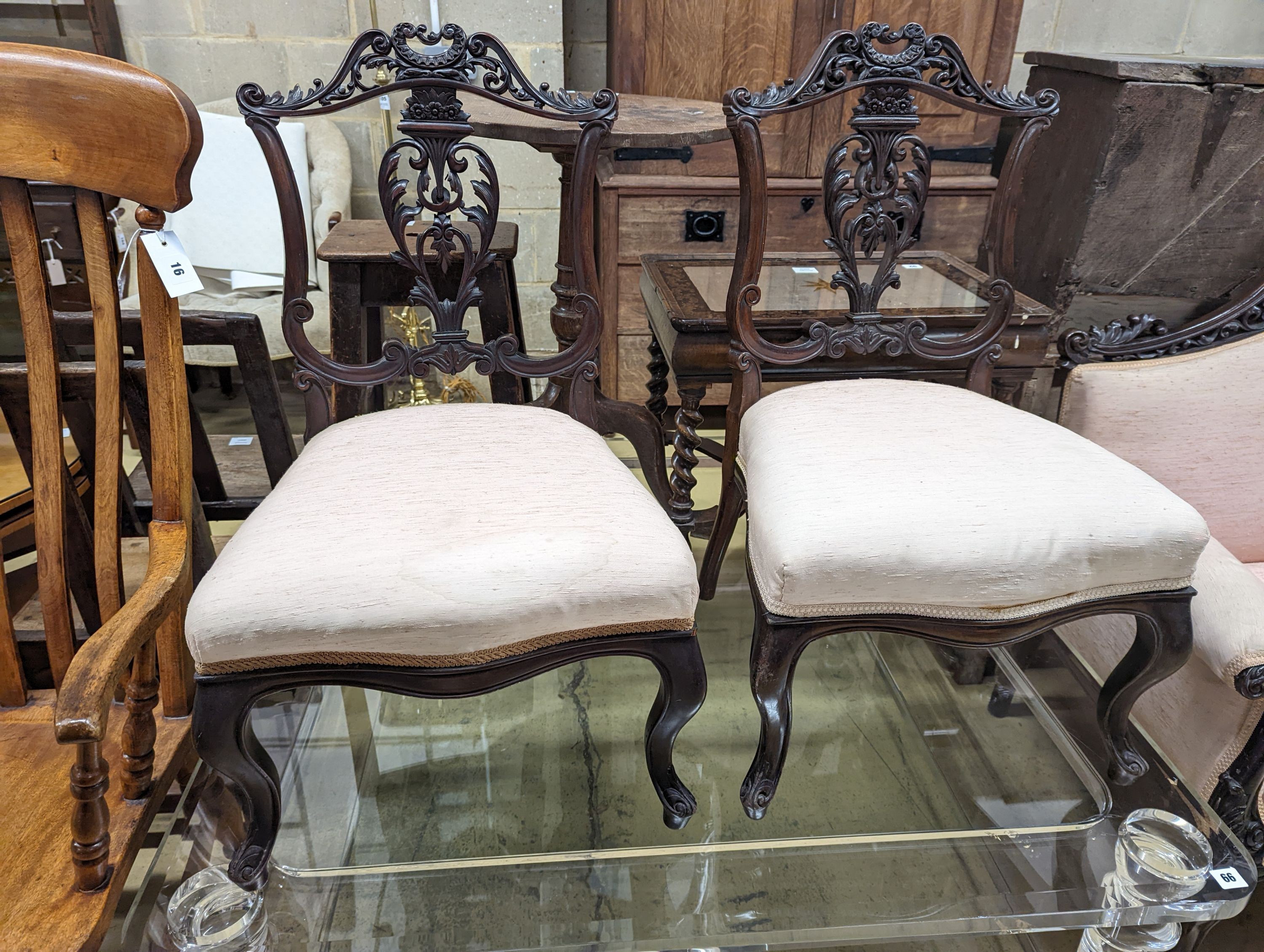 A late Victorian carved mahogany seven piece salon suite, settee length 140cm, depth 60cm, height 94cm